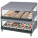 A Hatco countertop display case with food on shelves.