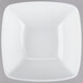 A Tuxton TuxTrendz white square bowl on a gray surface.