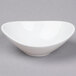 A Tuxton bright white china bowl with a small rim.