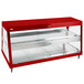 A red Hatco countertop display case with glass shelves.