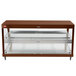 An antique copper and stainless steel Hatco countertop hot food display case with glass shelves.