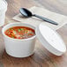 Two white Choice paper soup containers with vented paper lids and black spoons.