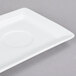 A white rectangular china tray with a narrow rim and a circular hole in the middle.