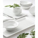 A Tuxton bright white rectangular china tray with tapered ends.