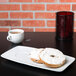 A TuxTrendz rectangular china tray with a bagel with cream cheese and a cup of coffee on it.