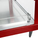 A red and stainless steel Hatco Glo-Ray food warmer with glass doors on a counter.