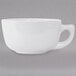 A Tuxton bright white cappuccino cup with a handle.