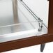 A stainless steel Hatco dual shelf food warmer with glass doors on a table.