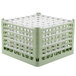 A light green plastic Vollrath glass rack with trays.