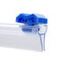 A close-up of a blue plastic Tablecraft slide cutter clip.