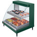 A green Hatco Glo-Ray countertop display case with food inside.
