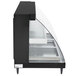 A black rectangular Hatco countertop display case with clear glass shelves and a glass door.