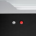 A close up of a black and silver Hatco countertop hot food display warmer with a red button.