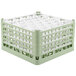 A light green Vollrath plastic glass rack with multiple compartments.