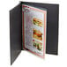 A black Menu Solutions Chicago screw-post menu cover with a menu inside.