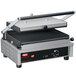 A black and silver Hatco panini grill with grooved plates on a counter.
