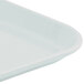 A close-up of a white steel Cambro tray.
