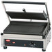 A close-up of a Hatco Multi Contact Panini Grill with grooved cast iron plates on a counter.