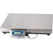 An Edlund digital receiving scale with a blue and silver display.