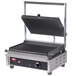 A Hatco panini grill with grooved cast iron plates on a counter.