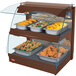 A Hatco Copper Glo-Ray countertop warmer with trays of food on it.