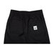 Chef Revival black chef trousers with a white logo patch on the side.