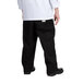 A person wearing Chef Revival black chef trousers.
