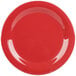 A close-up of a red GET Cranberry Diamond Harvest narrow rim plate.