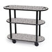 A Geneva three tiered laminate serving cart with black metal legs and wheels.