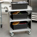 A Lakeside stainless steel utility cart with three shelves.
