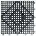A black plastic San Jamar Versa-Mat with a grid pattern of holes.