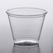 A Solo Ultra Clear PET plastic squat cold cup on a table.