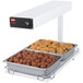 A Hatco portable heated shelf with a tray of meatballs and chicken.