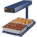A Hatco heated food warmer with trays of meatballs and chicken on a blue tray.