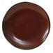 A brown Tuxton Artisan china plate with a black rim.