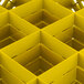 A yellow Vollrath Traex glass rack with square compartments.