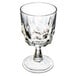 An Arcoroc clear glass wine glass with a faceted design.