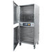 A large stainless steel Excalibur commercial dehydrator with two open doors.