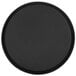 A black round Cambro Treadlite serving tray with a white circle.