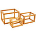 An American Metalcraft bamboo cube riser set with a couple of square frames on top.