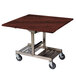 A Geneva tri-fold room service table with red maple finish on a metal cart with wheels.