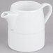 An Arcoroc white creamer with a handle.