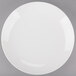 An Arcoroc white porcelain plate with a white rim.
