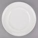 An Arcoroc Rondo white porcelain dinner plate with a white rim.