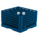 A blue plastic Vollrath Traex rack with glasses inside.