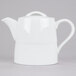 A white Arcoroc teapot with a curved white handle.