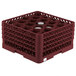 A Vollrath Traex full-size burgundy glass rack with 20 compartments.
