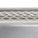 A close-up of a metal surface with a silver Edlund 1/4" blade assembly.