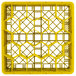 A yellow plastic Vollrath Traex rack with hexagons.
