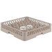 A beige Vollrath Traex glass rack with 20 compartments holding clear glasses.